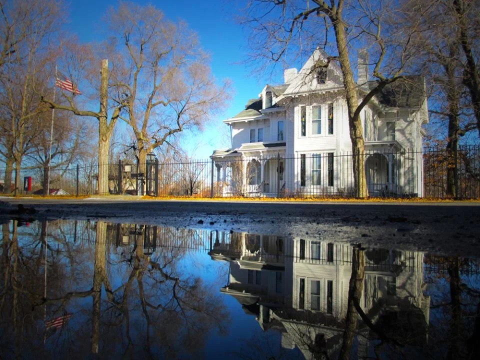 Archival view of Truman Home and melting-snow reflection from Delaware Street in Independence Missouri
