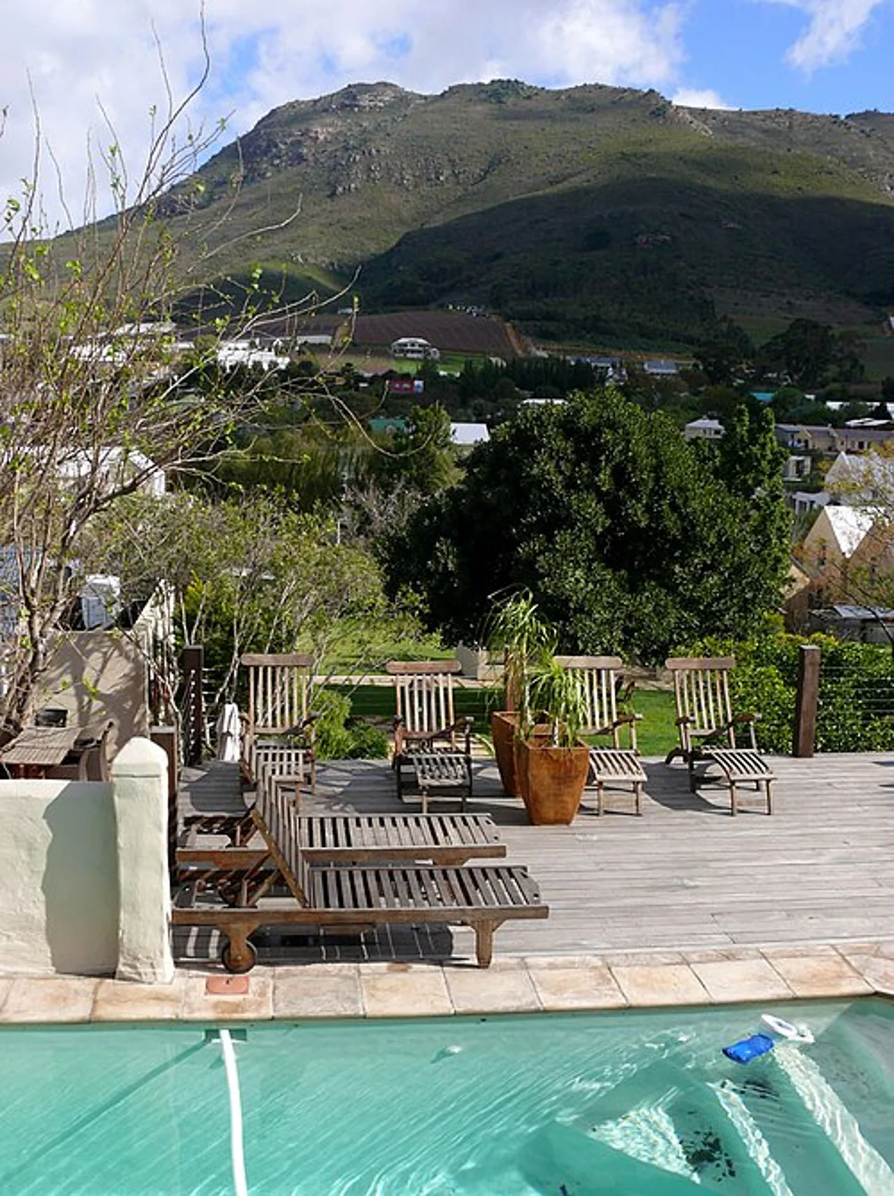 Garden and pool with town surroundings, 2011; not a public space or recommended accommodation.