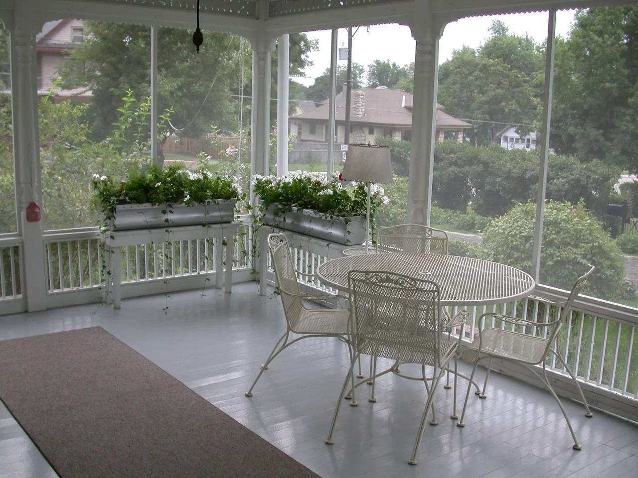 Archival table and chairs inside Truman Home enclosed rear porch; not a promise of current seating access
