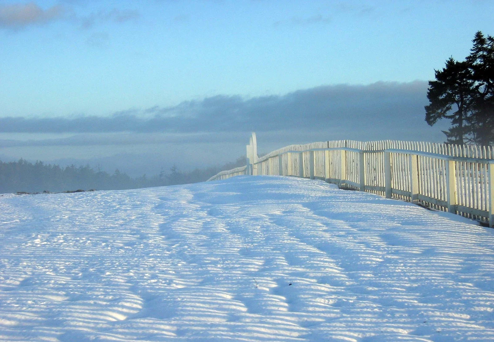 Snow and white fence on American Camp parade ground, San Juan Island 2006 winter archive