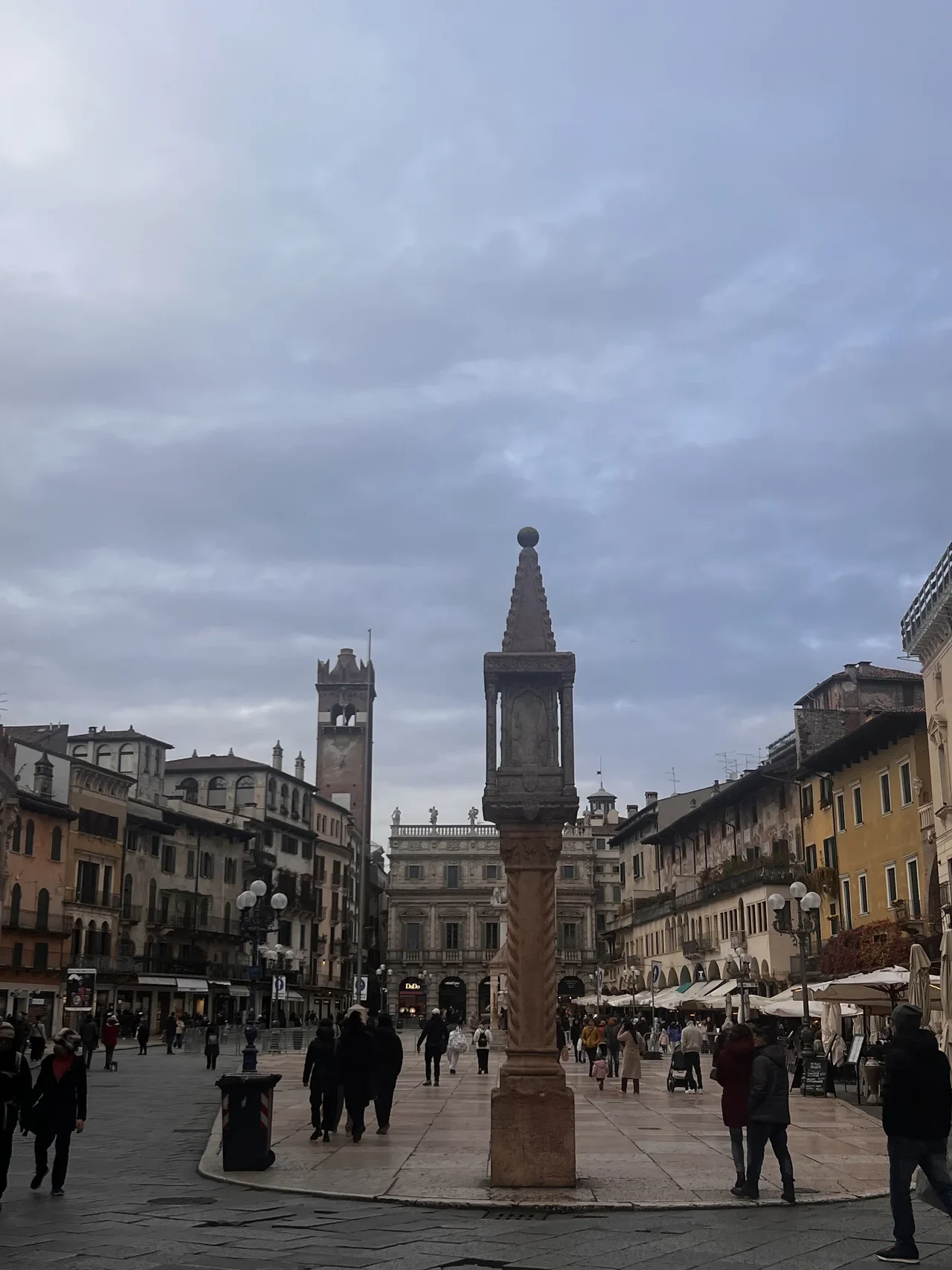 Column and historic façades in Piazza delle Erbe, January 2026