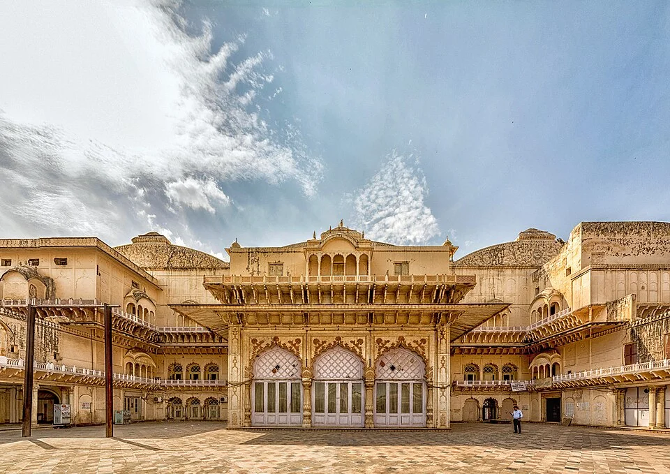 Arched facade and palace buildings in the Alwar City Palace courtyard