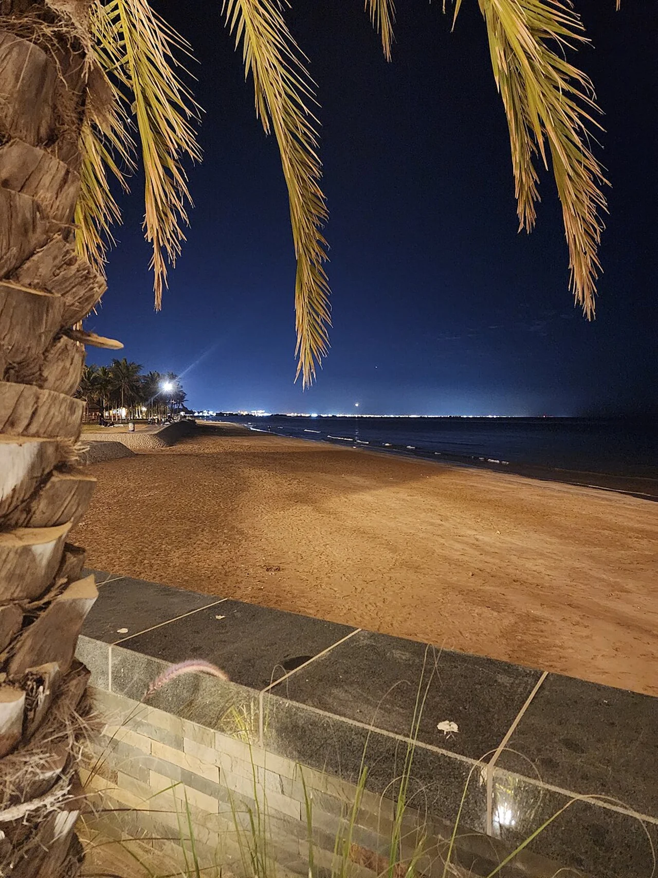 Qurum shore at night; Karananand2, 8 January 2025