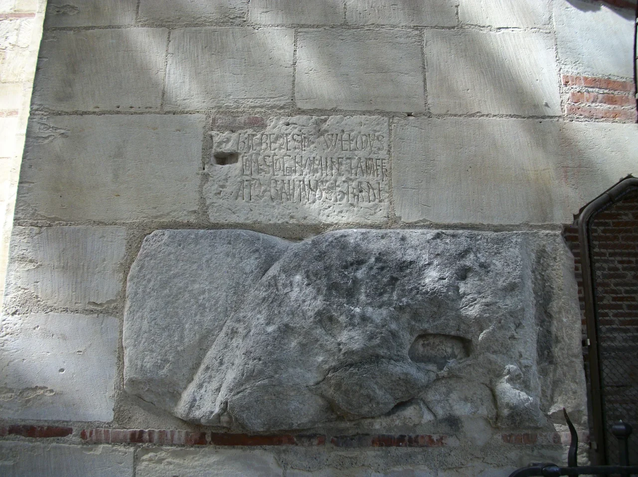 Stone relief and inscription detail at Saint-Sernin Basilica, September 2020