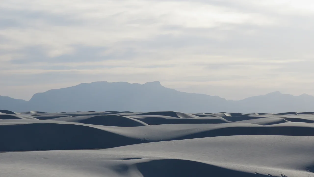 Archival view of white dunes and distant mountains at White Sands outside Alamogordo