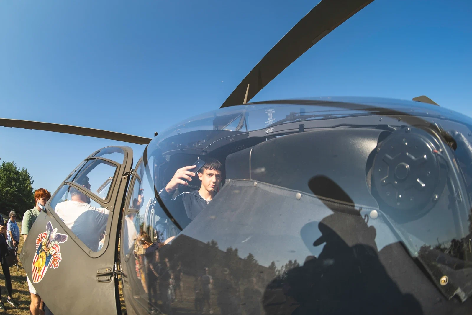 Visitor in a helicopter cockpit at Carlisle Army Expo 2025