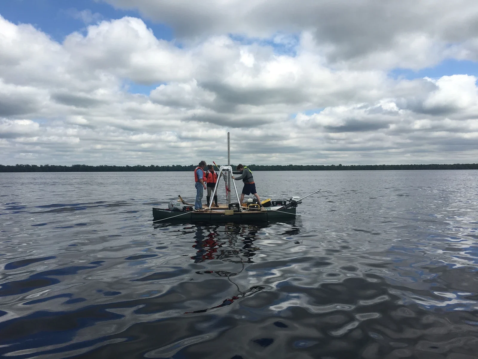 Archive photograph of researchers collecting sediment cores on Lake Drummond