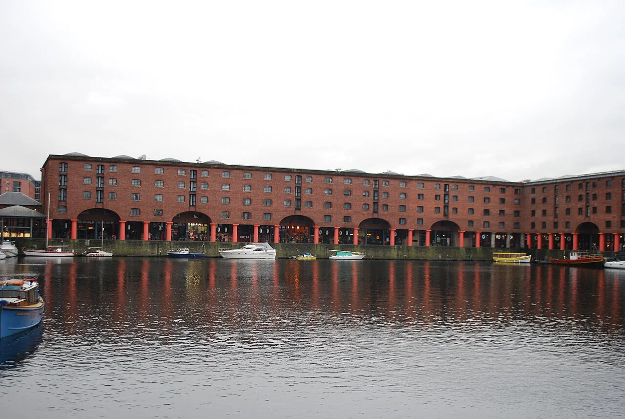 Red-brick warehouses and reflections on the water at Albert Dock, Liverpool; November 2009.