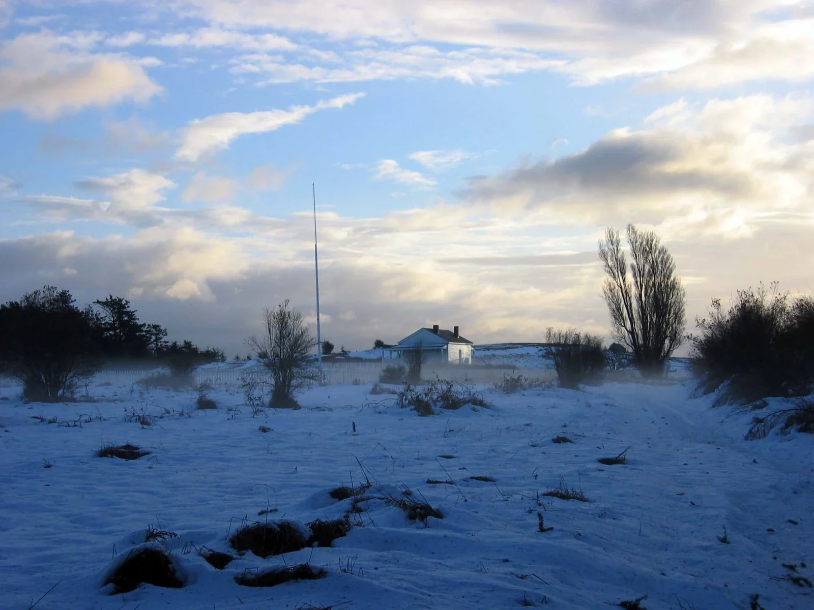 American Camp parade ground and distant building, San Juan Island winter archive