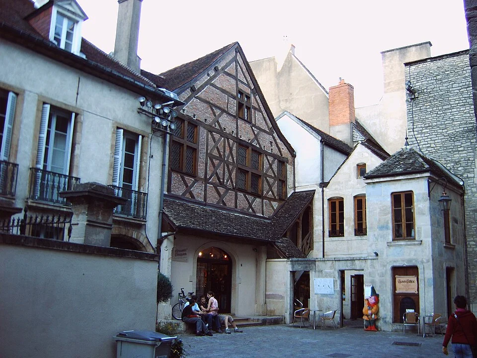 Street perspective between timber and stone fronts on Rue de la Chouette,8October2005.