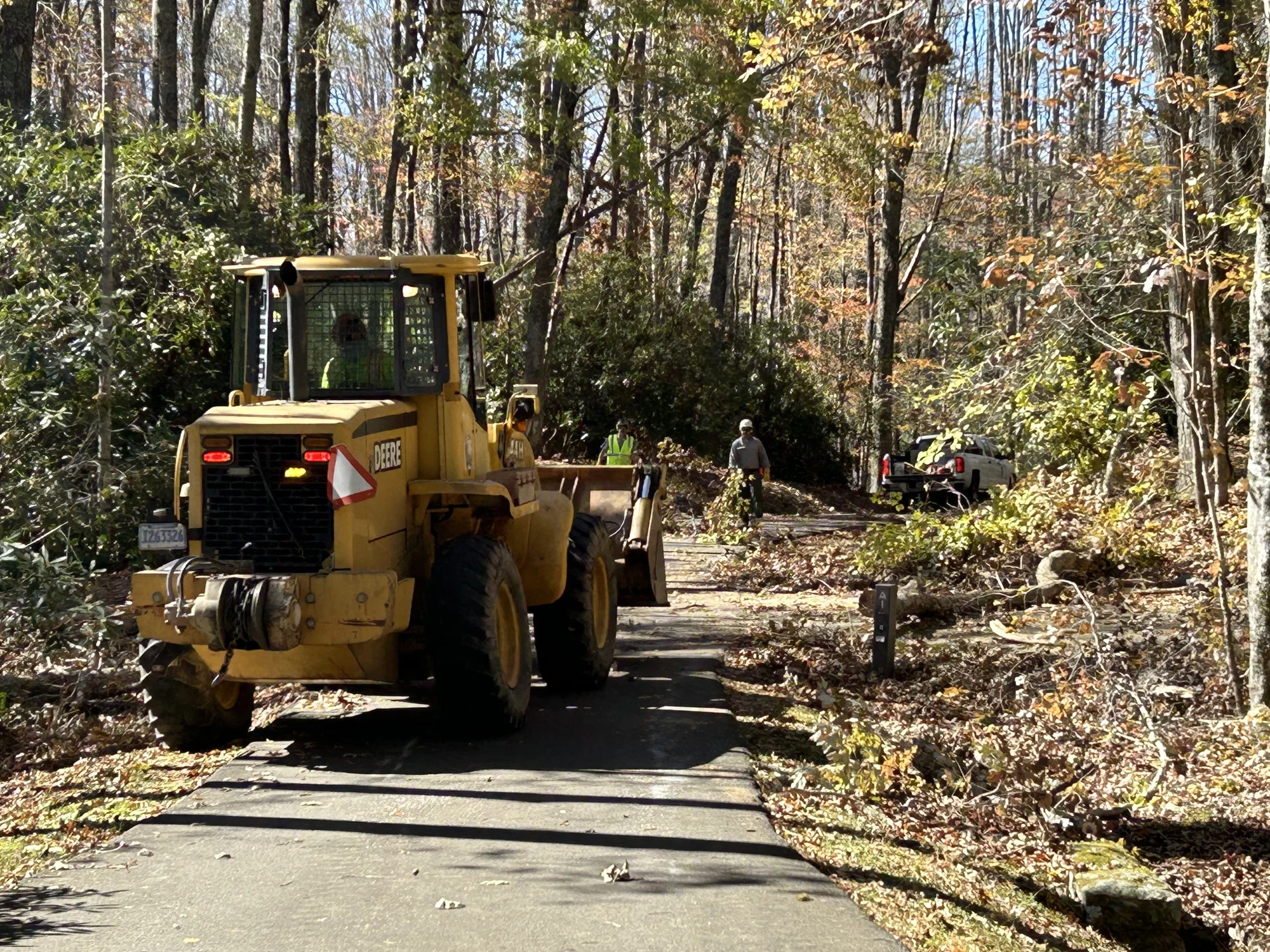 Archive debris removal crew and machinery near Julian Price Lake