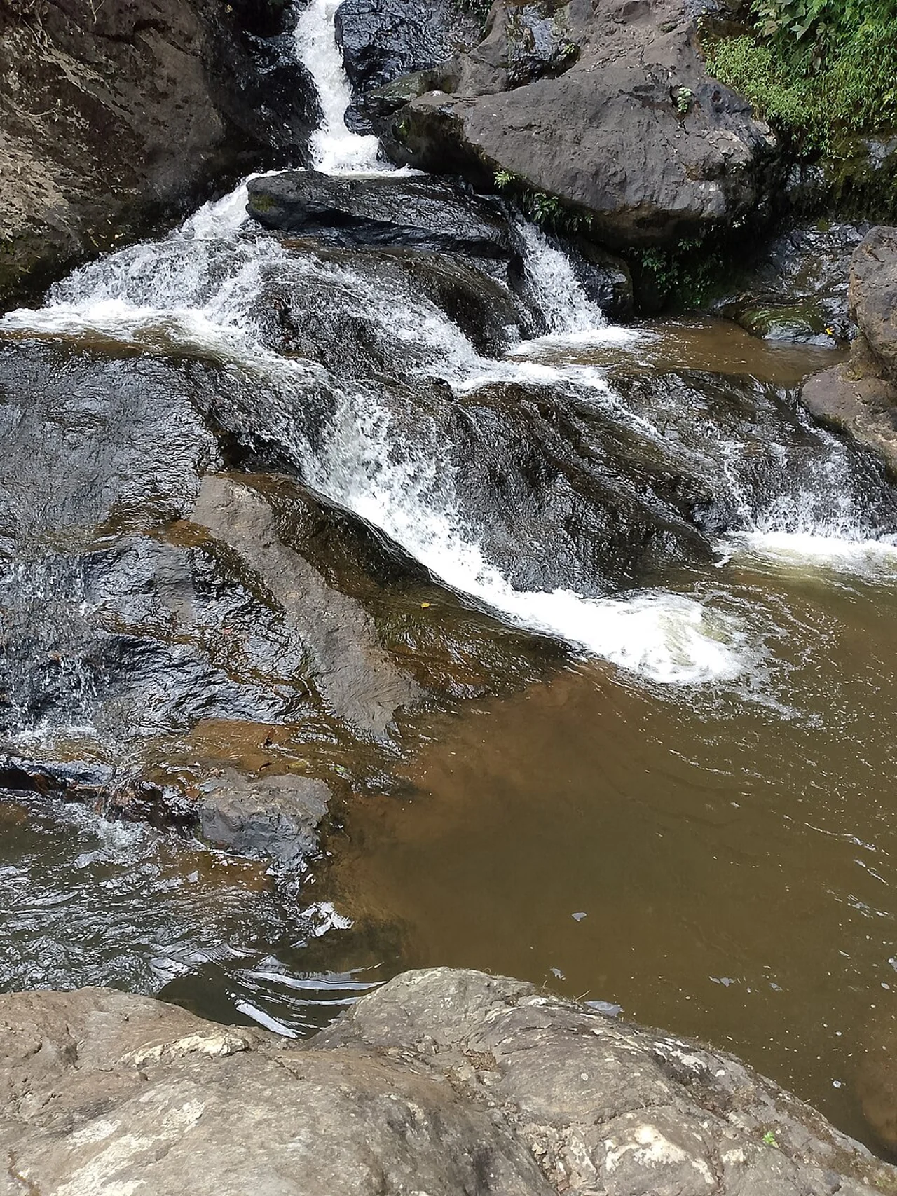 Waterfall and rocky stream around Kpalimé; FREDO EMPIRE, 13 February 2026, not identified as Womé