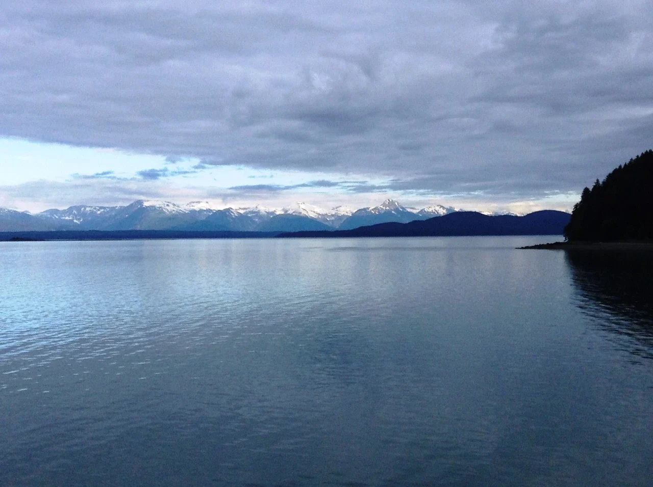 Calm sea and distant mountains on the Juneau–Gustavus ferry route