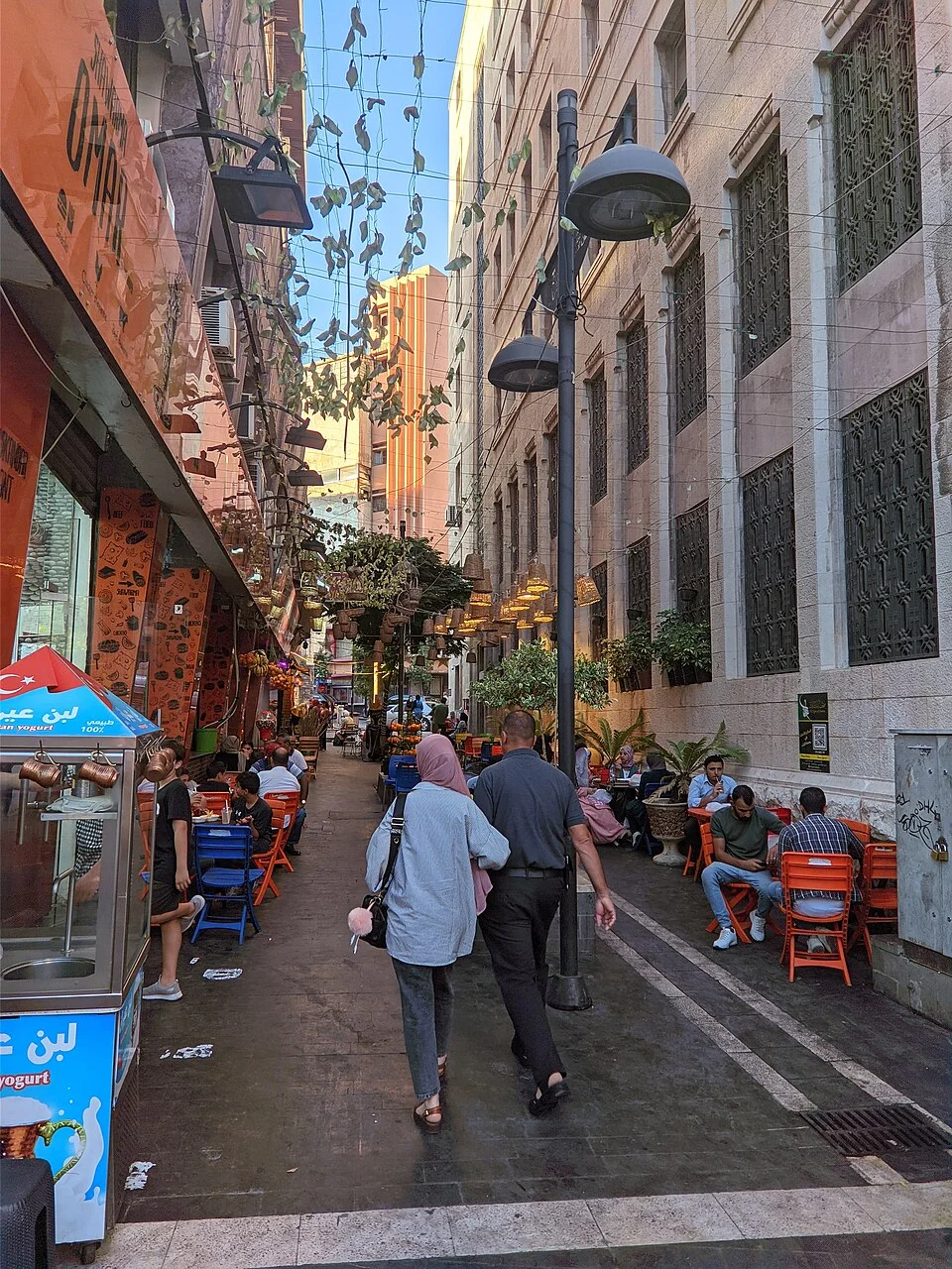 Café-lined walking street in downtown Amman; July 2022.