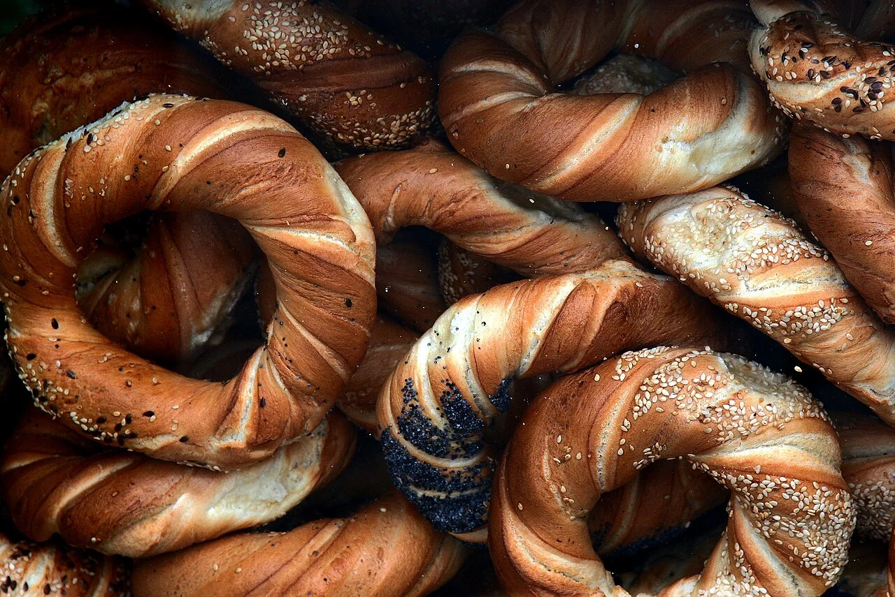 Assorted obwarzanki krakowskie ring-shaped breads with seeds; April 2009.