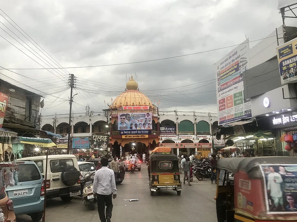 Domed building, market and street movement at Ganj Golai in Latur