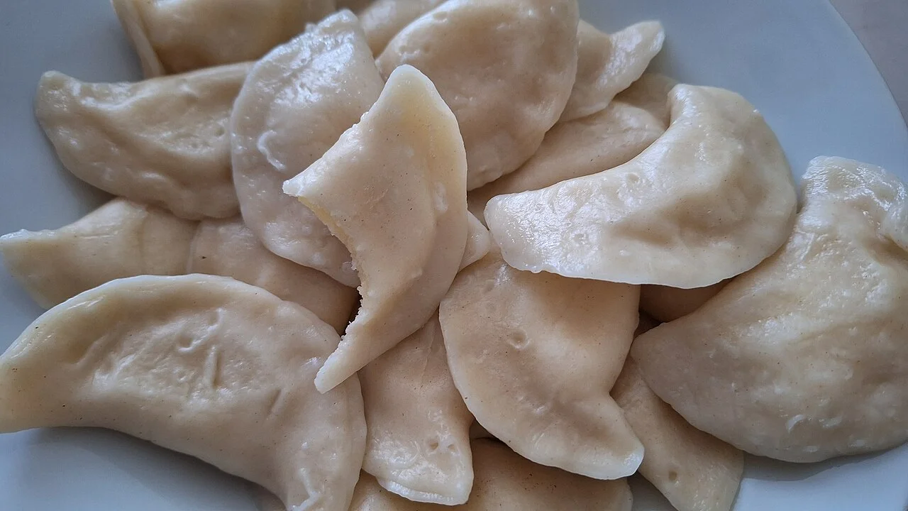 Illustrative plate of pierogi; February 2024, venue unconfirmed, not a Kraków restaurant photograph.