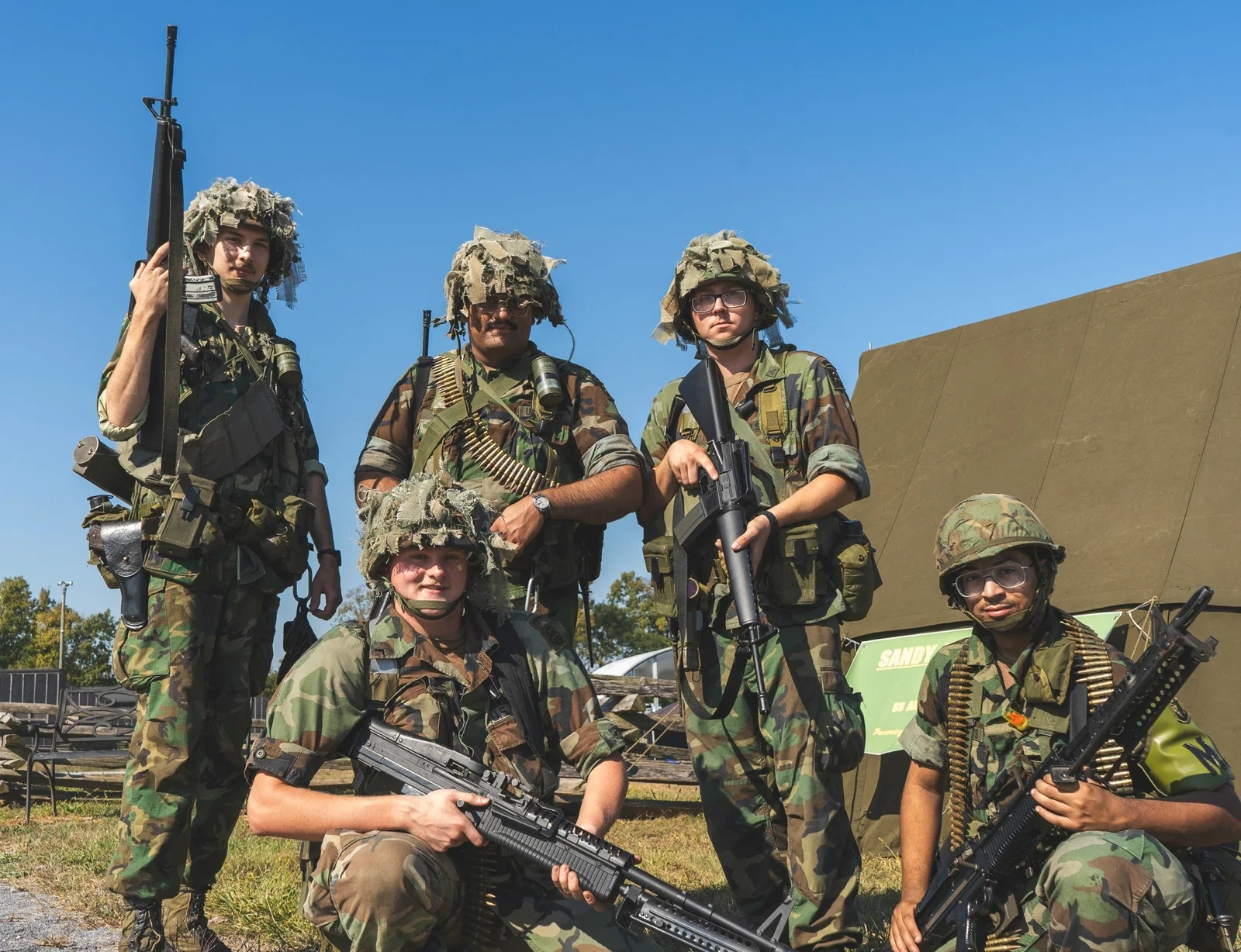 Five reenactors in historical uniforms at Carlisle Army Expo 2025