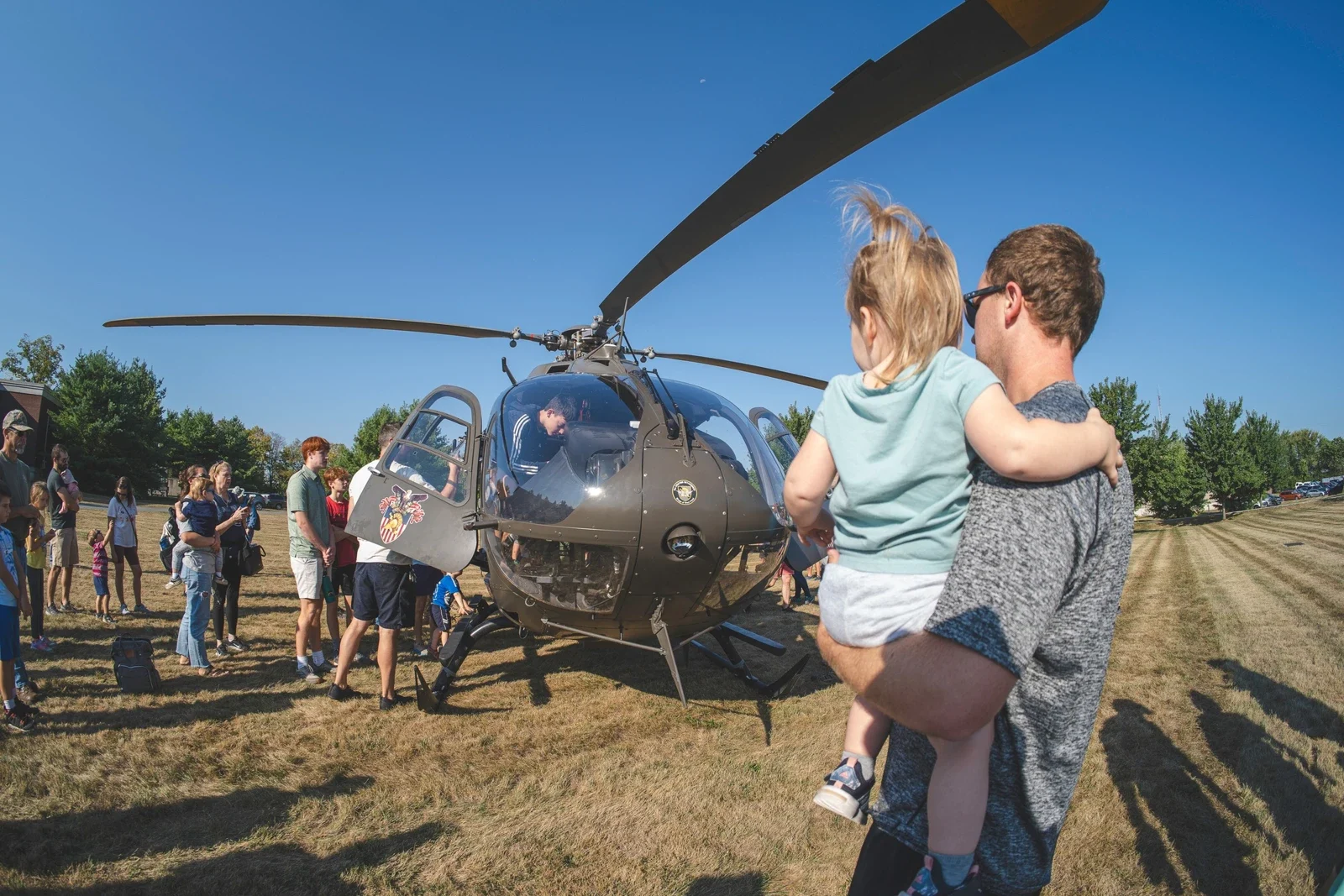 Visitors around a helicopter display at Carlisle Army Expo 2025
