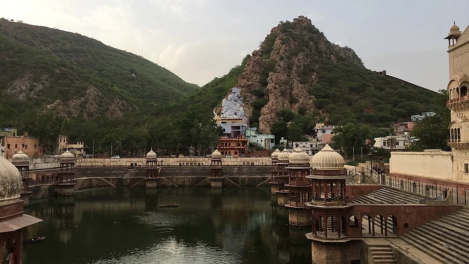 Stepped shores and pavilions of Sagar pond with the hills around Alwar