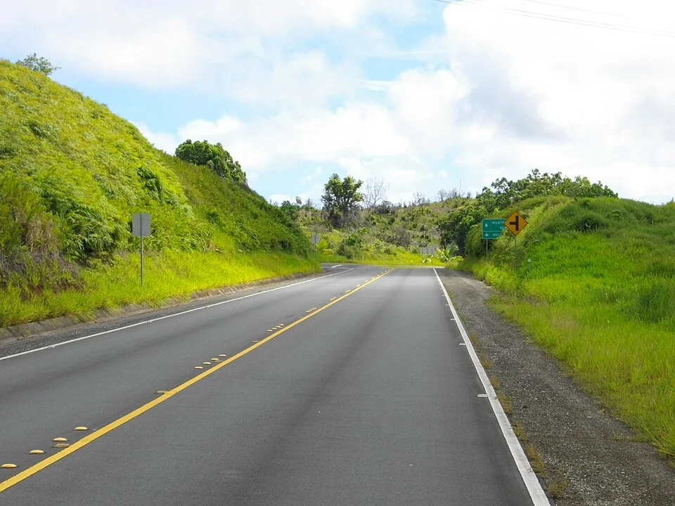 Compact Road and green slopes in Ngardmau, Palau