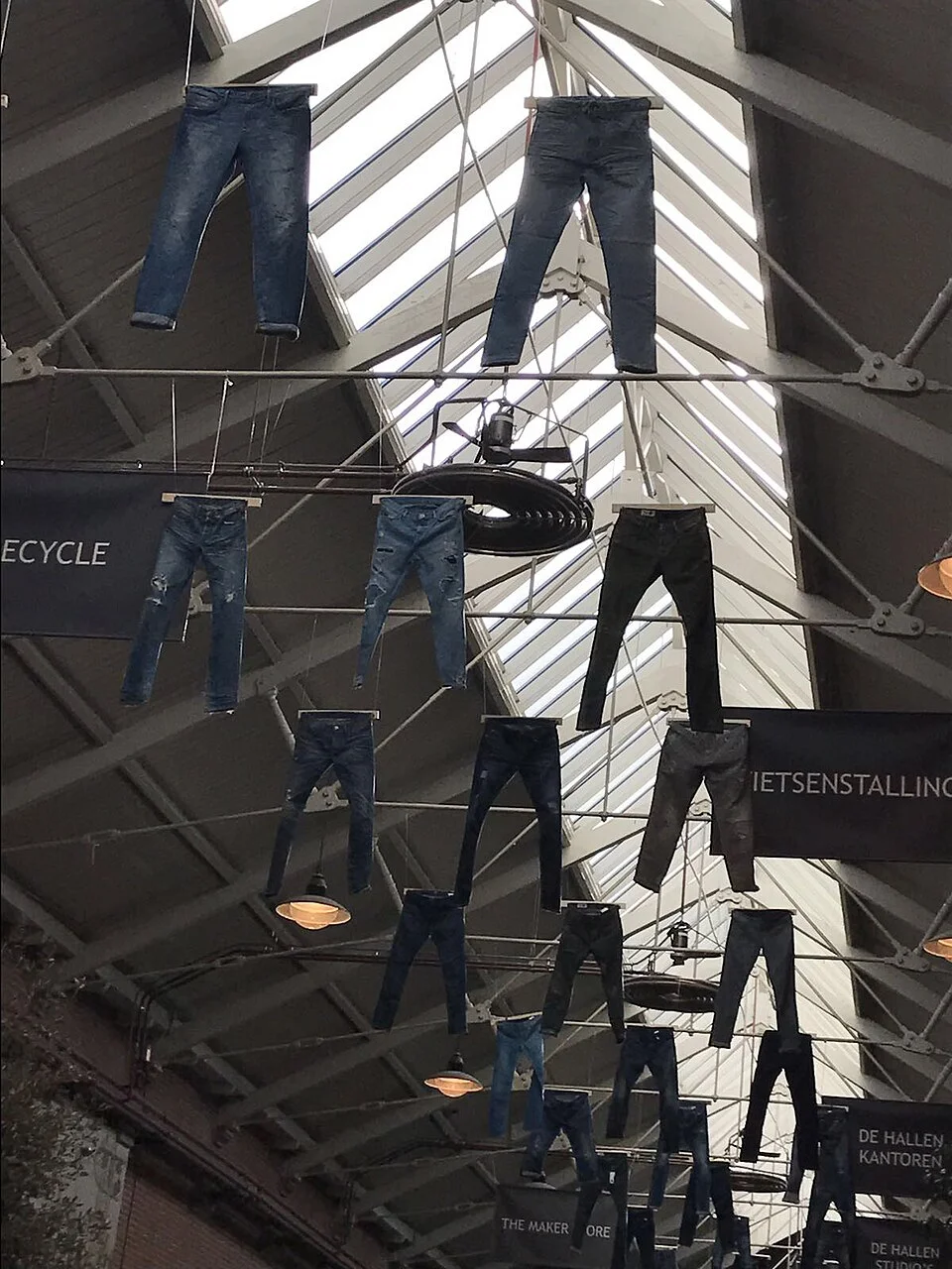 Hanging trousers at the Foodhallen venue in Amsterdam, interior setting; 2017-05-01