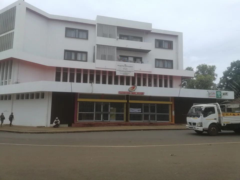 White facade of the Antsiranana post office beside the road