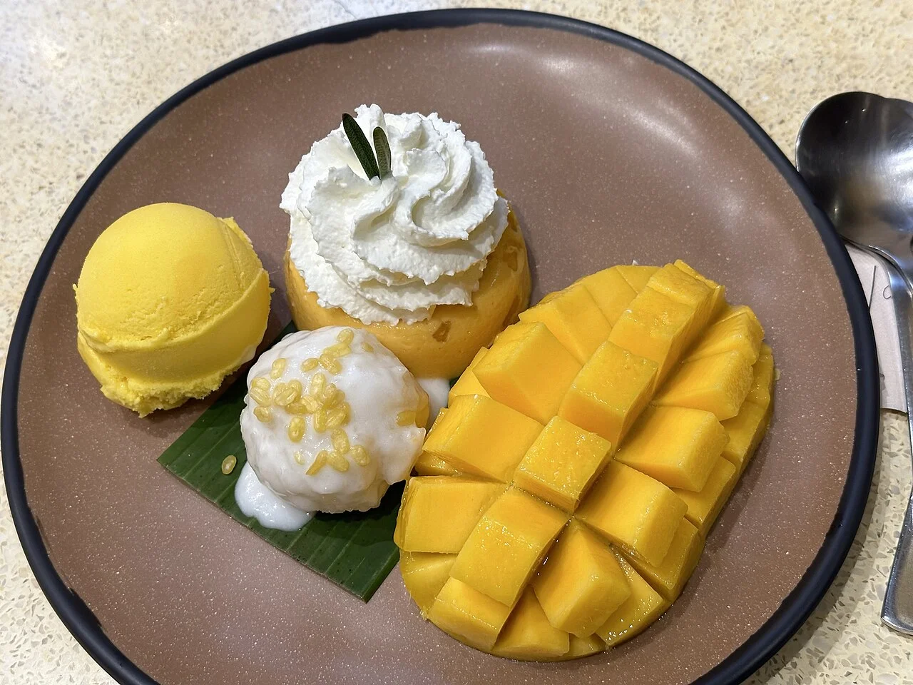 Mango, sticky rice, pudding and ice cream plate at Mango Tango, Bangkok; Zheng Zhou, 8 December 2023.