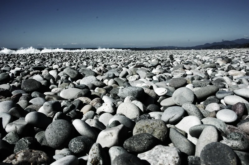 Pebbles and Black Sea waves on Batumi beach; May 2008 archive photograph.