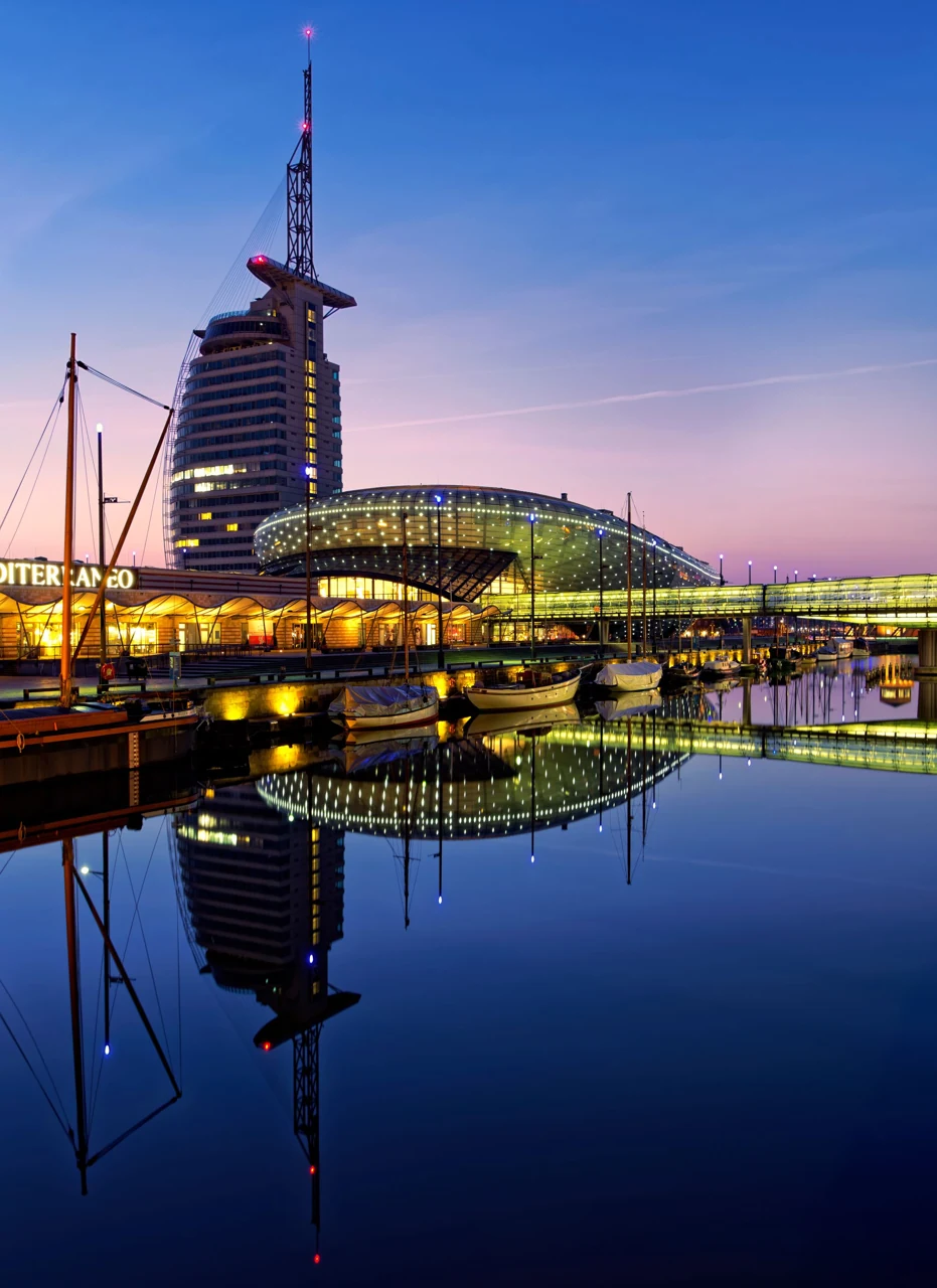 Klimahaus and the harbour basin at night in Bremerhaven