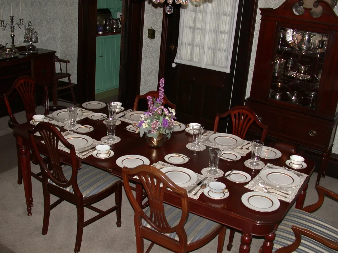 Archival photograph of the dining table and chairs in Truman Home