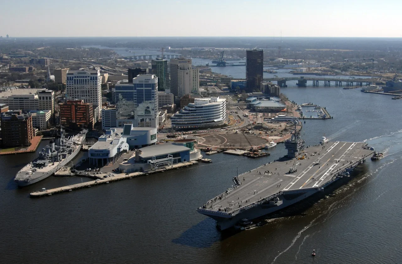 Military ship passing the Norfolk waterfront on the Elizabeth River, dated archive; not a current harbour schedule