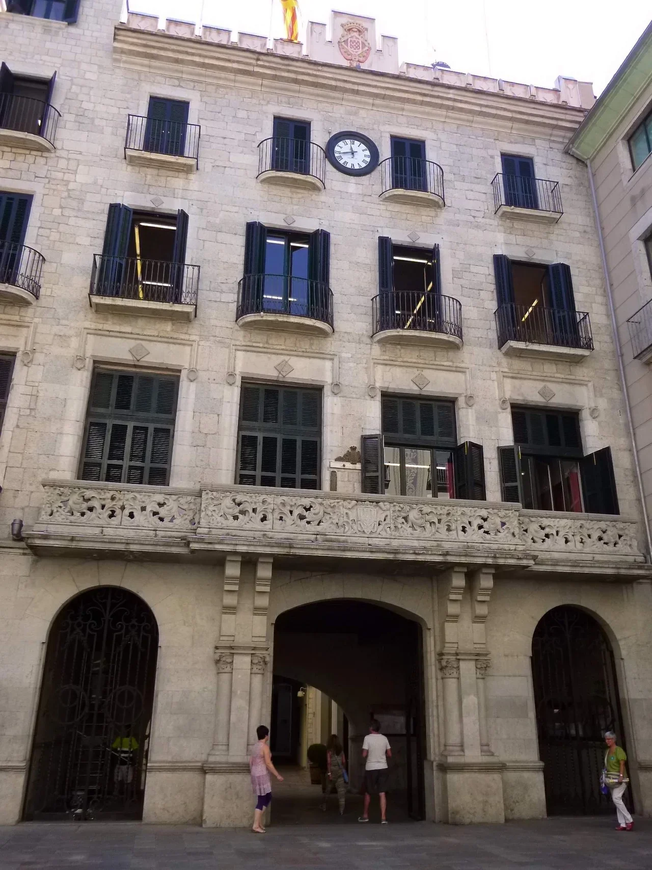 Stone façade and clock of Girona town hall, 2014