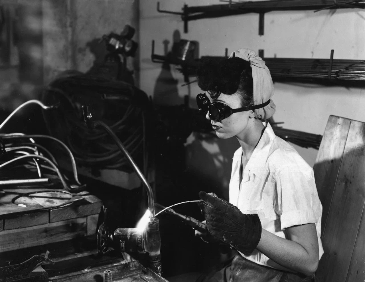 Welder working in goggles and gloves, Oak Ridge archive