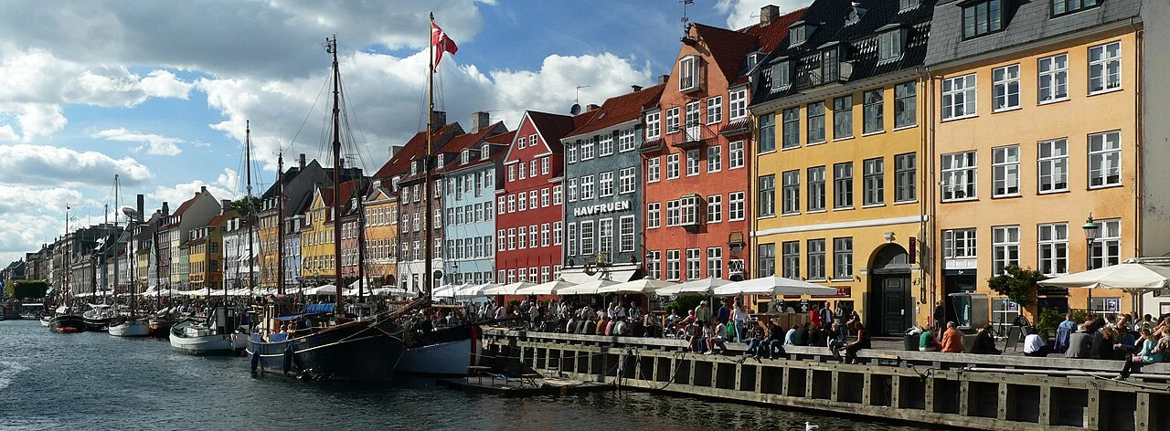 Nyhavn waterfront in Copenhagen; location context for a solo city walk. Scythian (Scythian~commonswiki), June 2008.