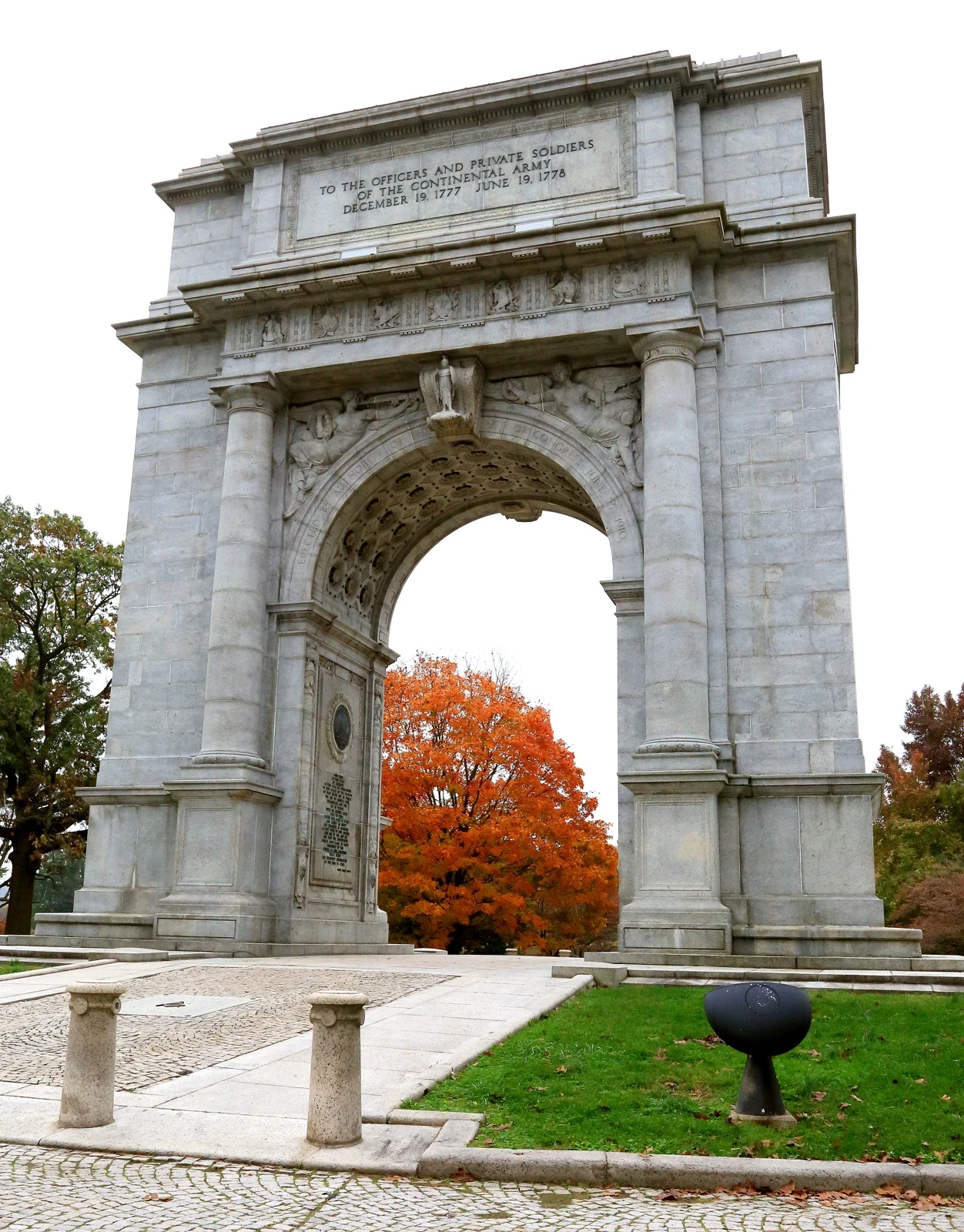 National Memorial Arch and an orange autumn tree at Valley Forge