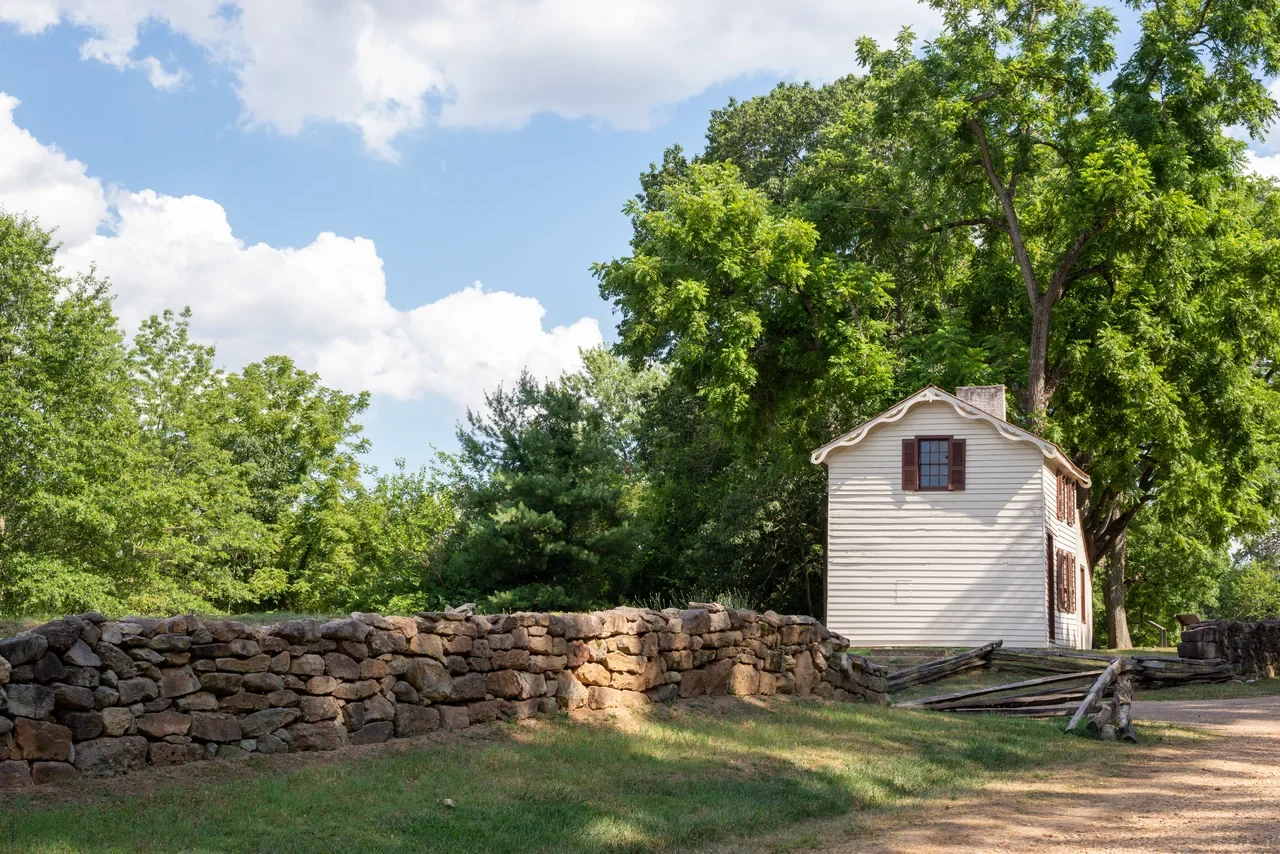 Innis House exterior and stone wall from public Sunken Road