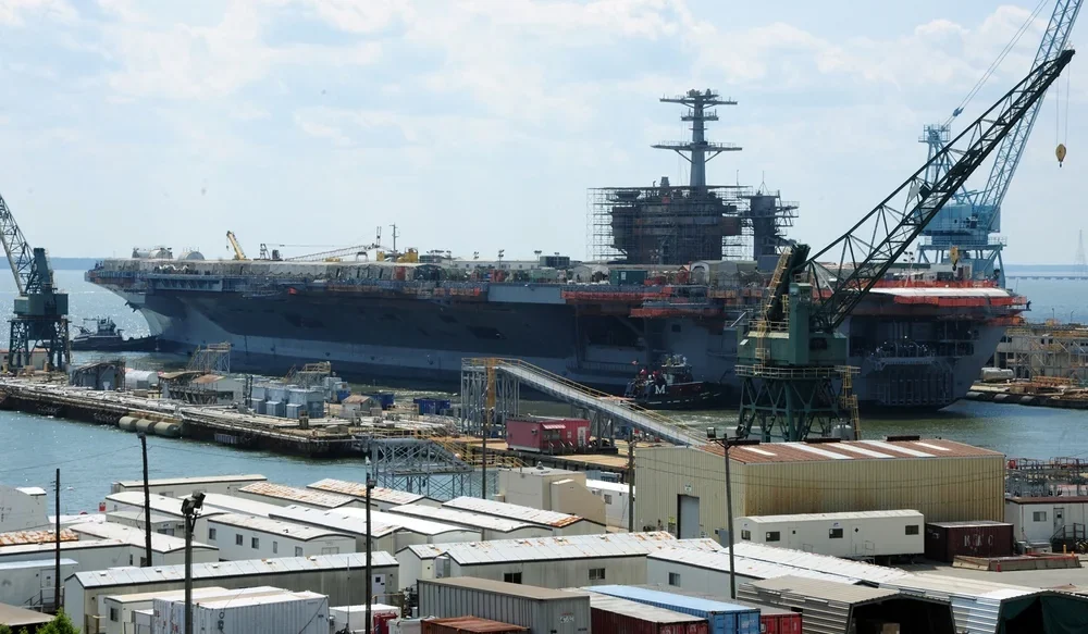 USS Theodore Roosevelt and tugboats on the James River,21 May 2011 archive; not current ship or tour information