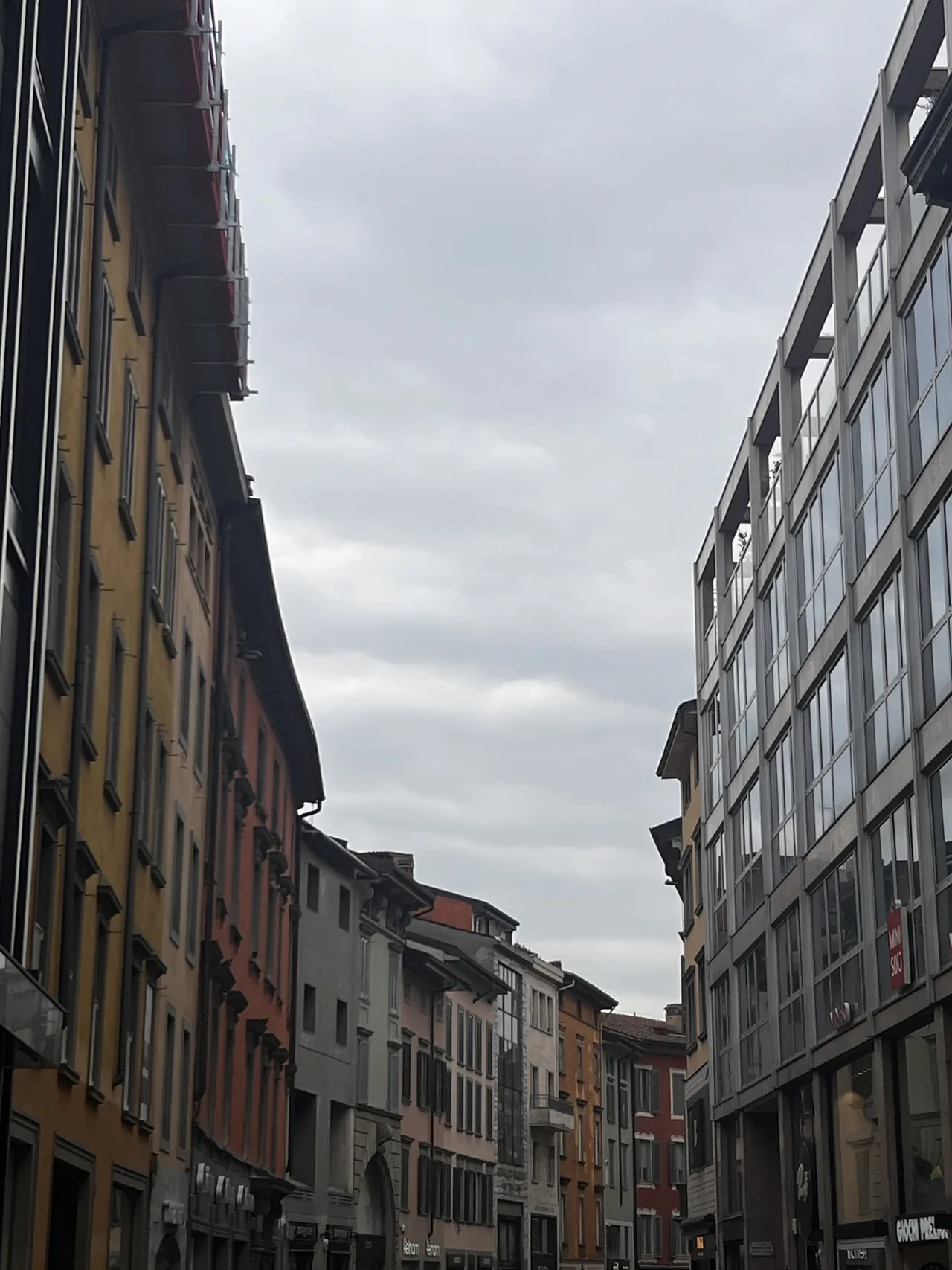 Street view between historic and modern facades in Bergamo, January 2026