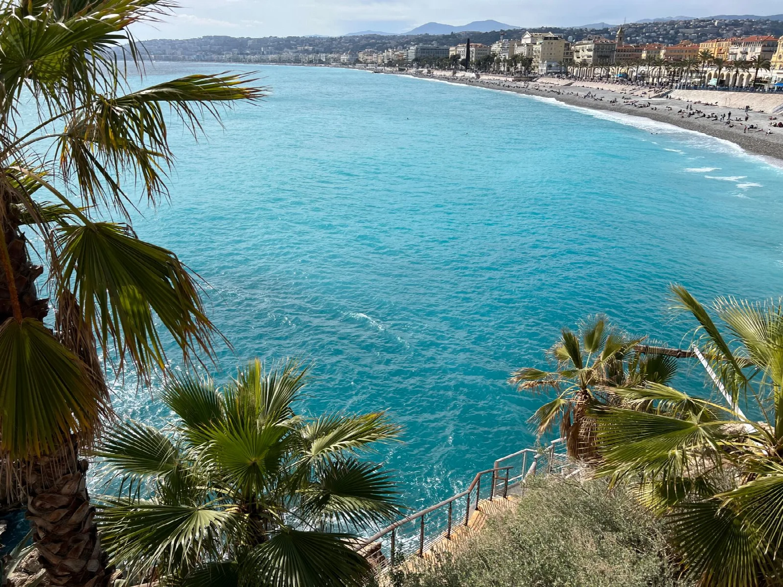 Turquoise sea and the city along the Nice waterfront