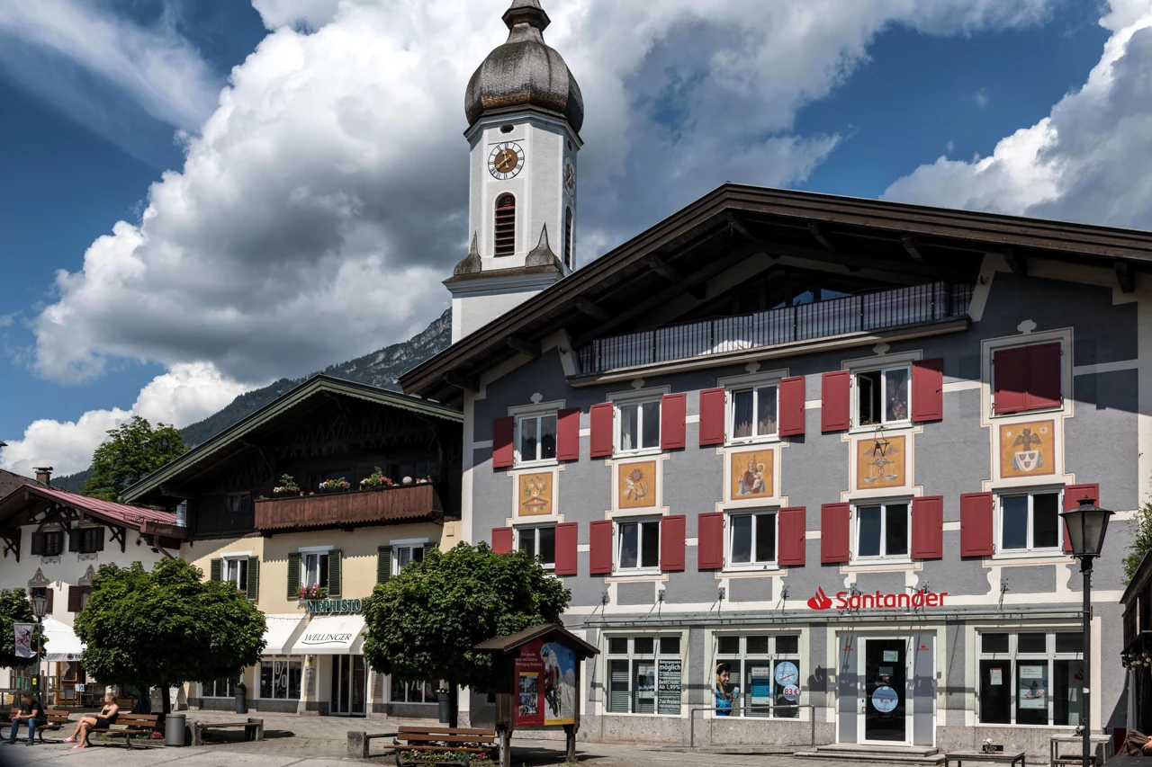 A different view of a painted red façade and bell tower in Garmisch