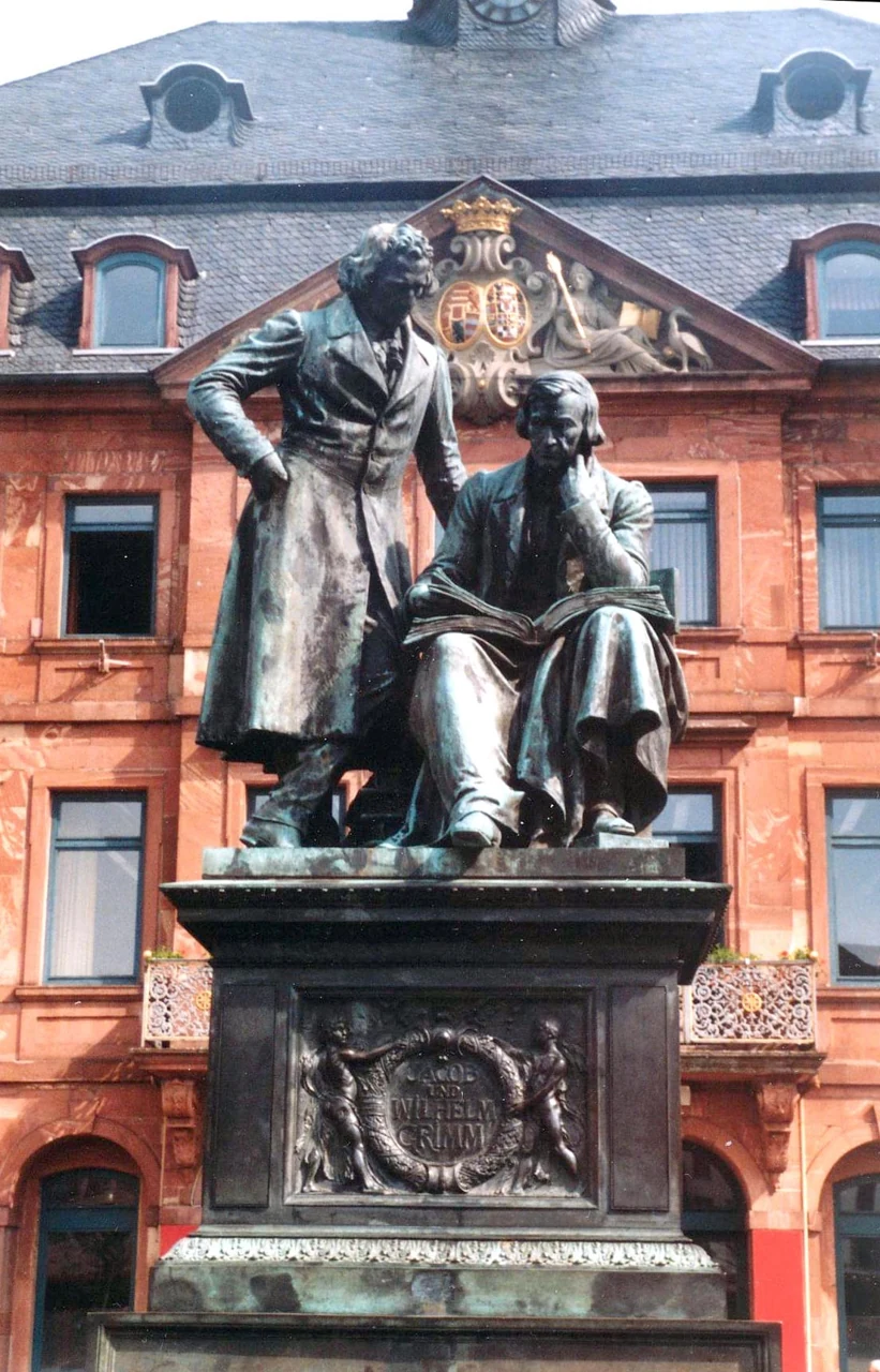 The Brothers Grimm monument with Rathaus behind in Hanau, 2005