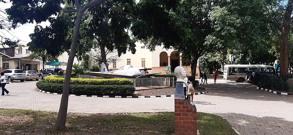 Trees, forecourt and the broad facade of Livingstone Museum