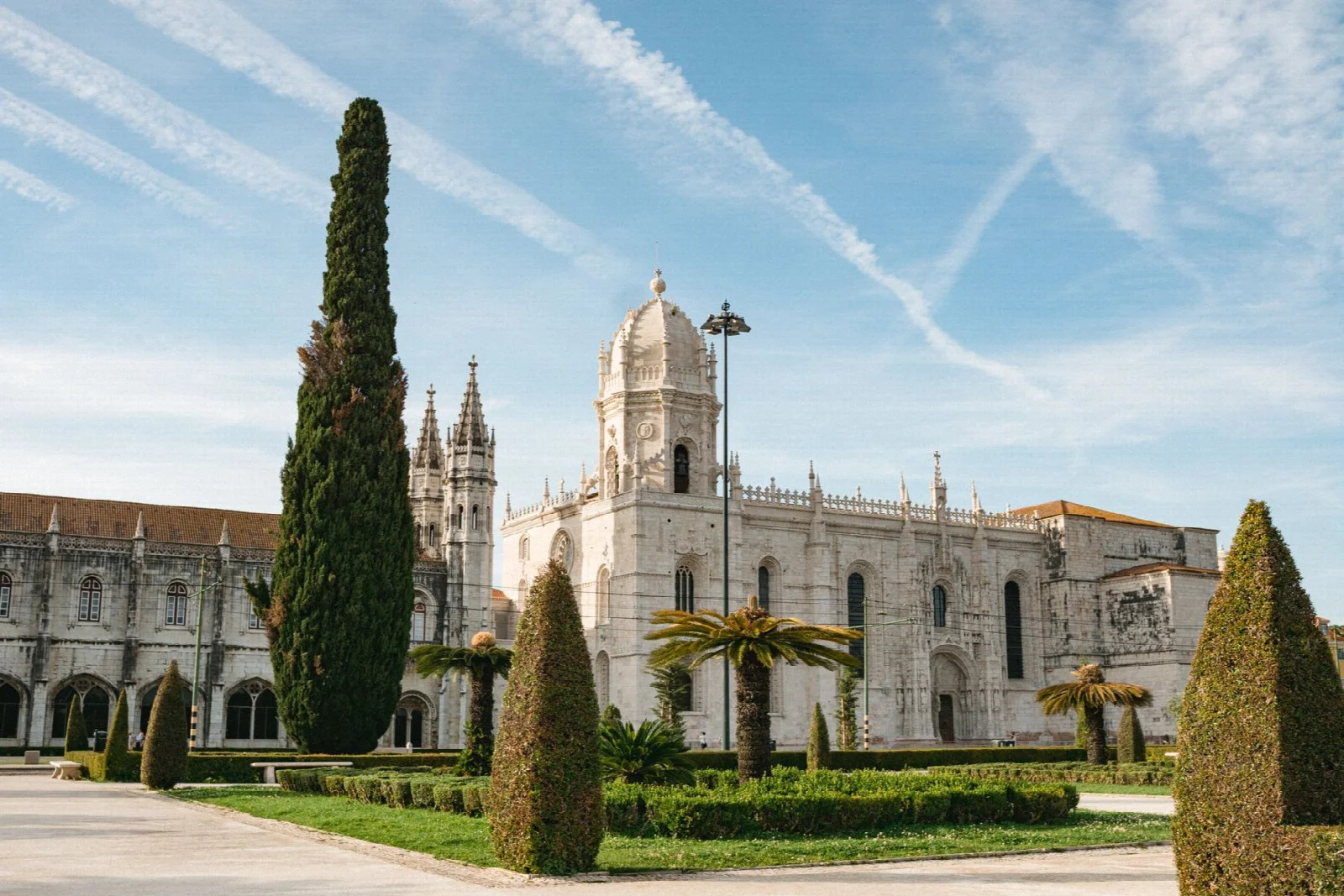 The long stone facade of Jerónimos Monastery in Belém, Lisbon
