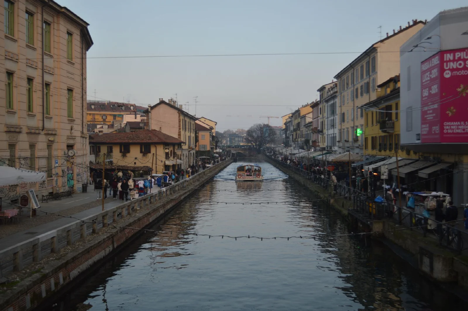 A canal, waterfront buildings and a footpath in Milan’s Navigli district