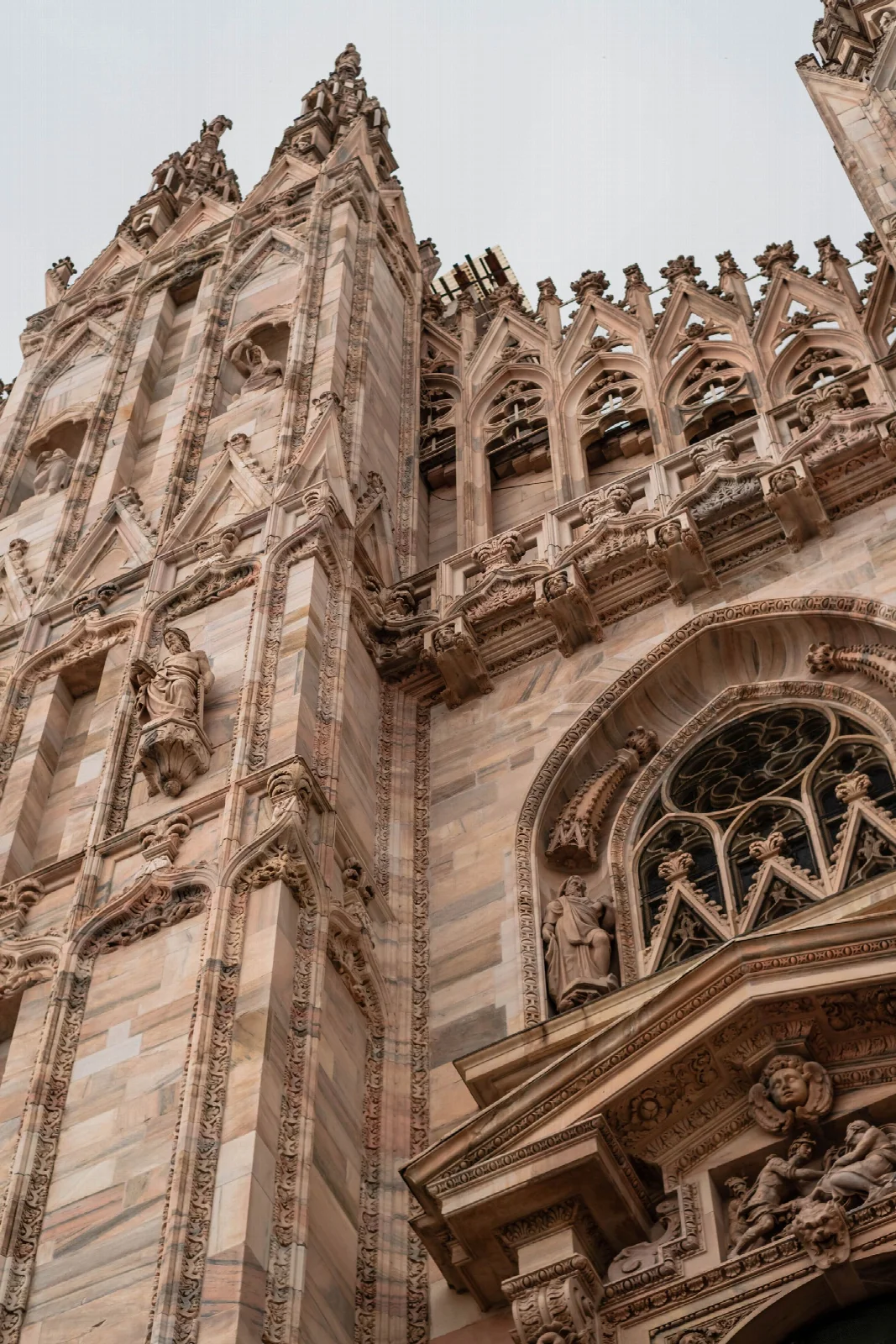 Gothic stonework and sculptures on the facade of Milan Cathedral