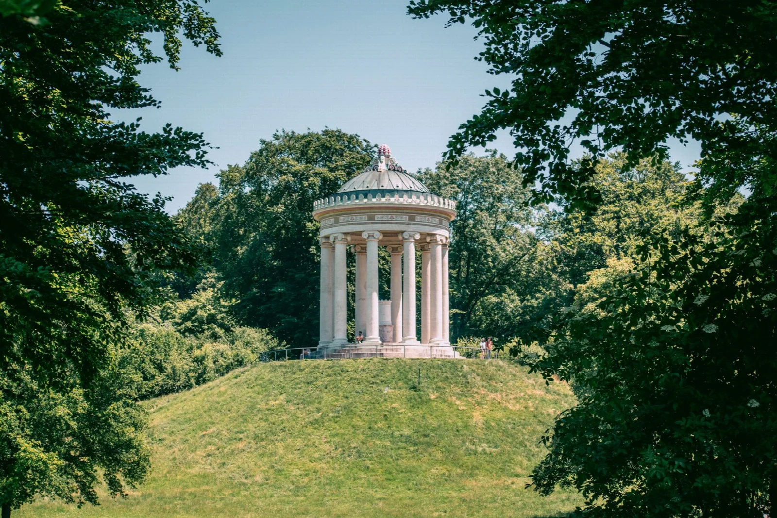 The Monopteros among trees in Munich English Garden