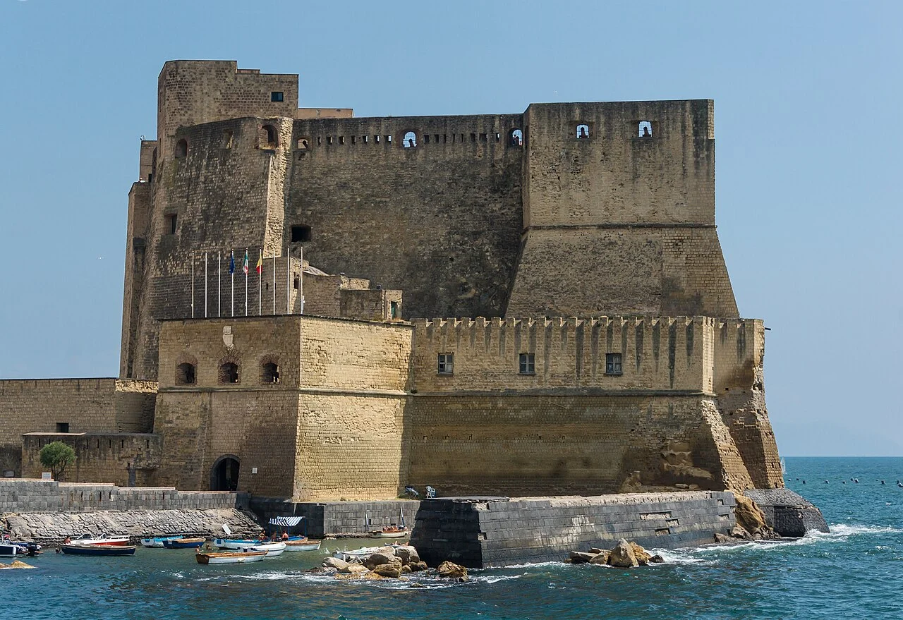 Exterior walls of Castel dell’Ovo beside the sea in Naples; July 2015 photograph.