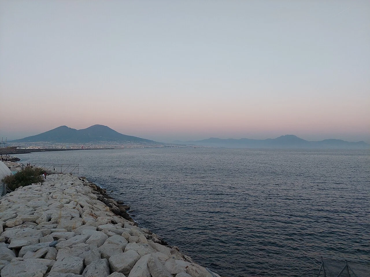 Bay and silhouette of Vesuvius from the Naples waterfront, photographed in May 2025.
