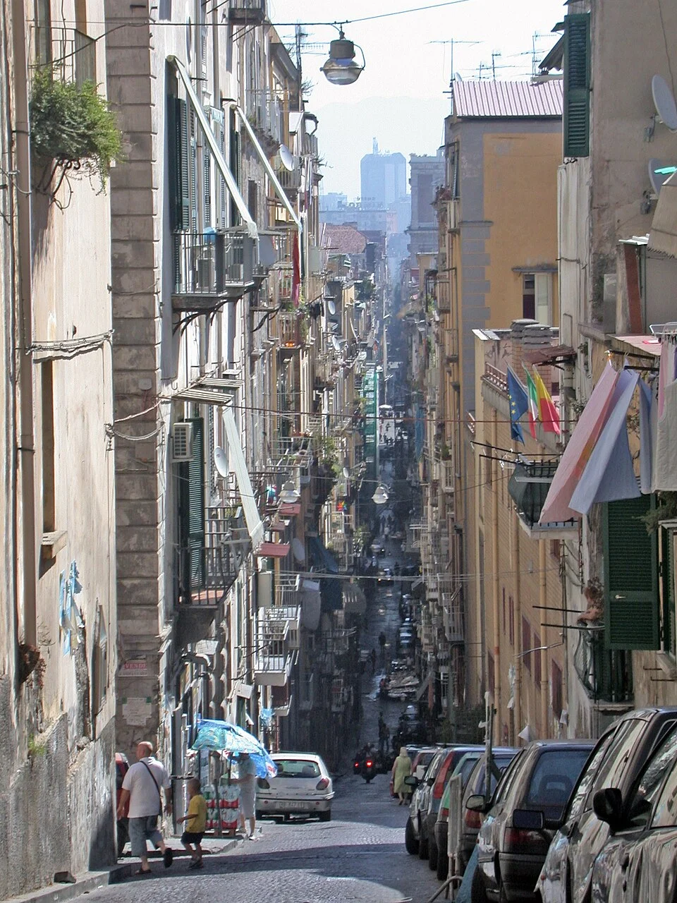 The Spaccanapoli street line in Naples with buildings and period traffic; July 2007 archive photograph.